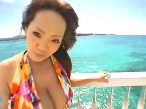 Beautiful Asian babe Hitomi Tanaka naked at the beach