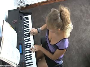 Blonde Melissa playing piano