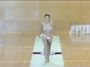 Another sexy Romanian gymnast doing her exercises topless